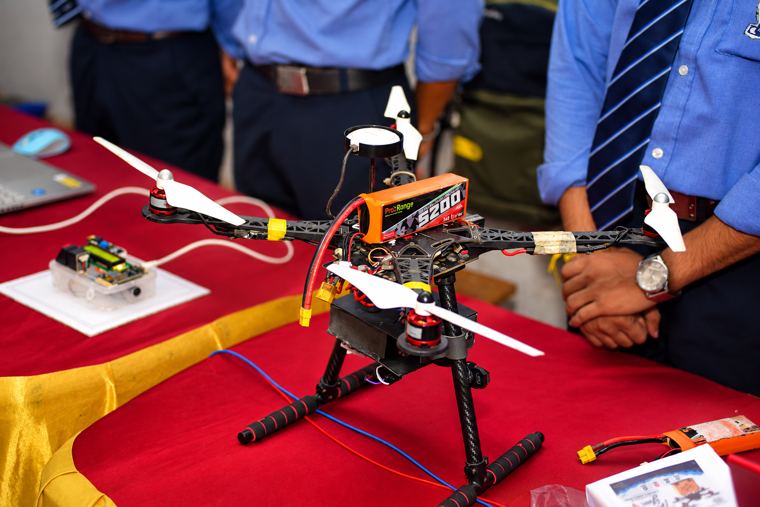 A student-built quadcopter with flight controller and LiPo power pack